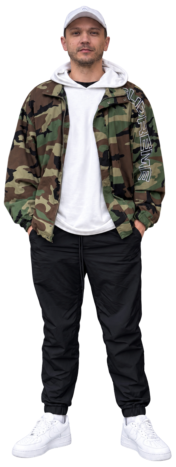 Colin in a camouflage jacket, white hoodie and cap