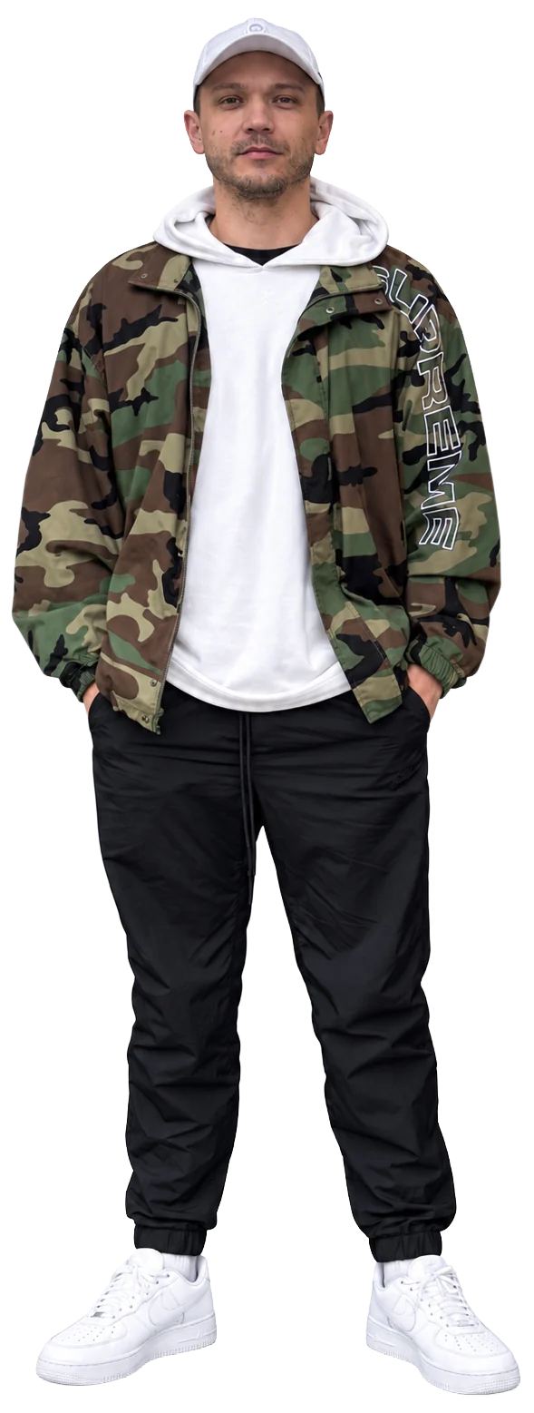 Colin in a camouflage jacket, white hoodie and cap